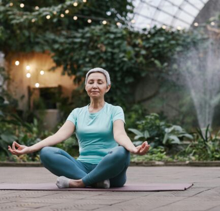 a woman in middle of meditation